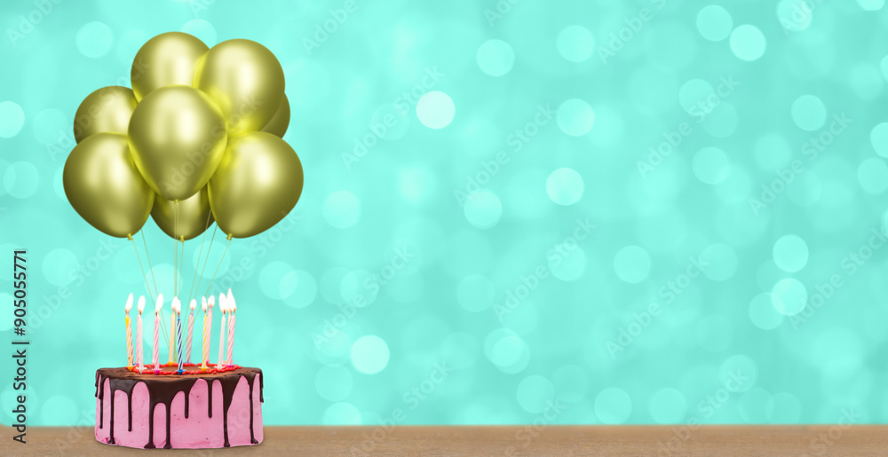 Poster birthday cake with bunch of golden or yellow balloons on blurred green background. empty space for t
