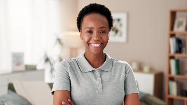Portrait, smile and caregiver with confidence at house for healthcare assistance, volunteer and retirement services. Black woman, ams crossed and nurse pride for helping, care and wellness support