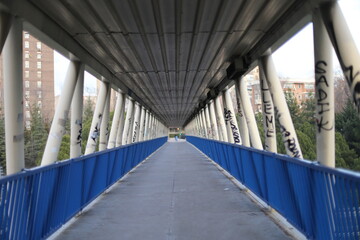 A bridge in the city of Madrid allows you to go from one neighborhood to another. working-class neighborhoods and graffitis