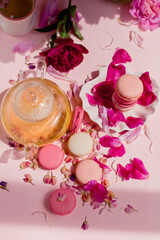 a pot of tea, dessert and flowers