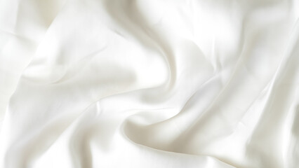 Crumpled white silk fabric background with soft folds and delicate texture.