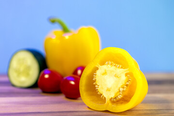 yellow bell peppers on wooden table, set of vegetables  