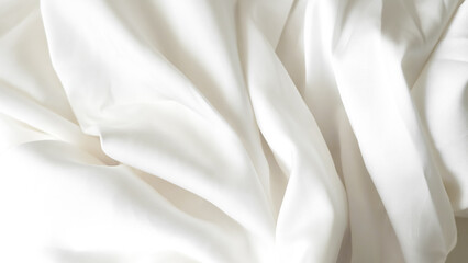 Crumpled white silk fabric background with soft folds and delicate texture.