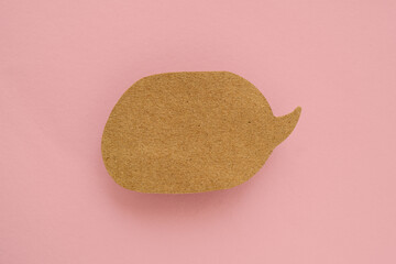 real grunge recycle brown speech bubble paper cut on pink background , top view. Conceptual image about communication and social media, customer feedback