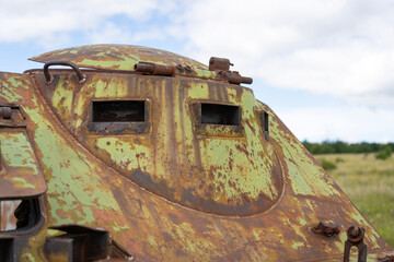 Spyhole of a rusty old soviet military vehicle wreck