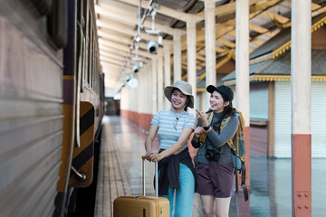 Happy Travelers with Luggage and Backpacks at Train Station Ready for Adventure