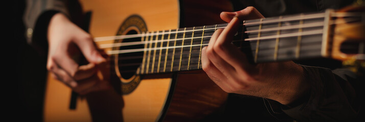 Fototapeta premium A man plays the guitar at the International Guitar Festival.