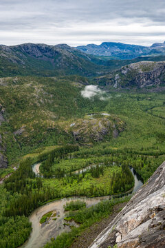 Wilderness forest, mountain and river landscape in Northern Norway at Rago national Park