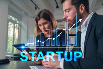 Business team analyzing data with a startup growth chart overlay.