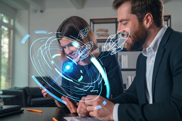 Business professionals using futuristic technology in office.