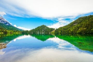 Obraz premium Landscape at Hintersteiner See near Scheffau in Tyrol. Idyllic nature at the mountain lake in the Wilder Kaiser nature reserve in Austria. 
