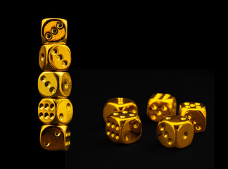 golden dice on black bacground