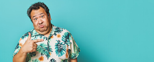 Overweight man in Hawaii tropical shirt, making funny face, pointing finger to side empty copy space. Generative AI