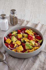 Healthy Fresh Corn Salad in a Bowl, side view. Copy space.