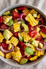 Healthy Fresh Corn Salad in a Bowl, top view. Flat lay, overhead, from above.