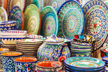Multicolored ceramic dishes with oriental ornaments at the Siab Bazaar.