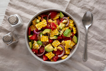 Healthy Fresh Corn Salad in a Bowl, top view. Flat lay, overhead, from above.