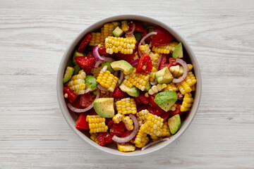 Healthy Fresh Corn Salad in a Bowl, top view. Flat lay, overhead, from above.