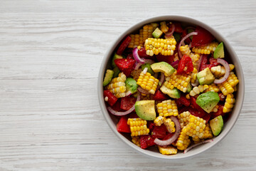 Healthy Fresh Corn Salad in a Bowl, top view. Flat lay, overhead, from above. Copy space.