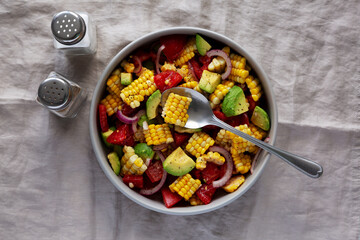 Healthy Fresh Corn Salad in a Bowl, top view. Flat lay, overhead, from above.