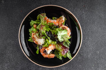 shrimp salad prawns or langoustines green leaf lettuce mix fresh meal food snack on the table copy space food background rustic top view 