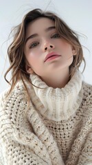 portrait of a beautiful young woman in a white sweater