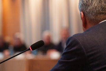 Black microphone in conference room