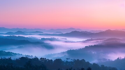 Fototapeta premium the serene beauty of sunrise over mist-covered mountains with soft pastel colors. sunrise over misty mountains, beautiful nature and wild landscape