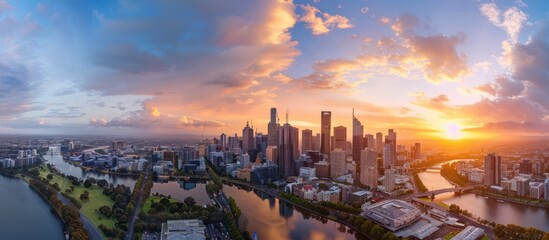 Fototapeta premium Melbourne City Skyline at Sunset. Aerial Panoramic View of Modern Architecture and Urban Landscape