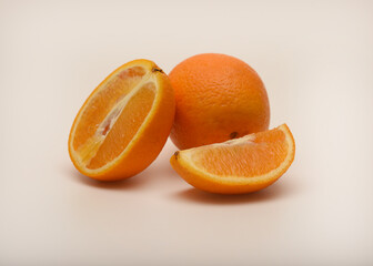 Oranges on a white background. Chopped fruits.