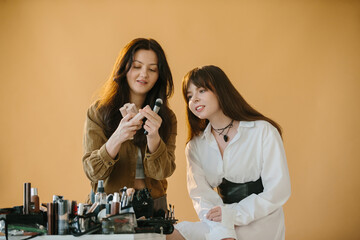 Professional Makeup Artist and Model Preparing for a Photo Shoot