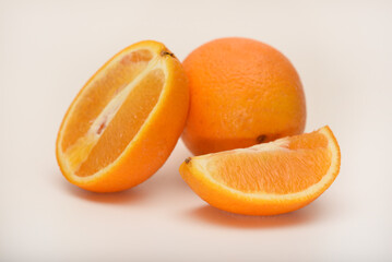 Oranges on a white background. Chopped fruits.