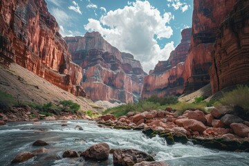 A Rushing River Flows Through A Canyon Of Red Cliffs