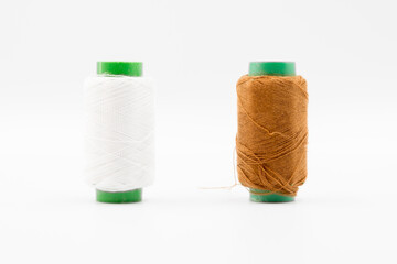 Colorful Spool of sewing thread, spool of industrial threads, Colored spools of thread on a white background.