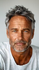 Obraz premium Portrait of a Mature Man with Gray Hair and Blue Eyes
