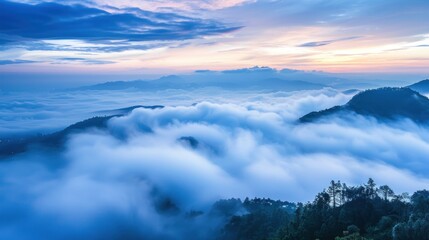 Fototapeta premium Misty Mountain Sunrise with Silhouetted Peaks