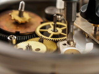 Close-up of a mechanical mechanism with gears, symbolizing watch repair and complex micromechanics