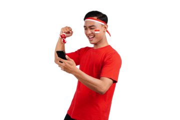 An Indonesian man celebrating Indonesia's independence day on 17 August while holding smartphone with blank screen isolated transparent