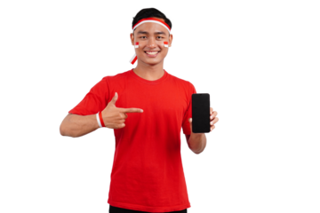 An Indonesian man celebrating Indonesia's independence day on 17 August while holding smartphone with blank screen and pointing isolated transparent