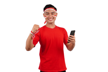 An Indonesian man celebrating Indonesia's independence day on 17 August while holding smartphone with blank screen isolated transparent