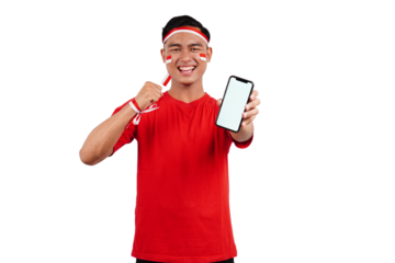 An Indonesian man celebrating Indonesia's independence day on 17 August while holding smartphone with blank screen isolated transparent