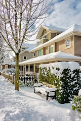 Street of residential duplex houses on sunny winter day in Canada