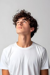 Fototapeta premium Portrait of a Young Man Looking Upwards