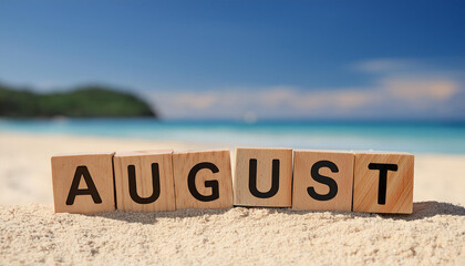 Wooden cubes with word AUGUST against sandy beach. Travel and vacation. Summer time concept
