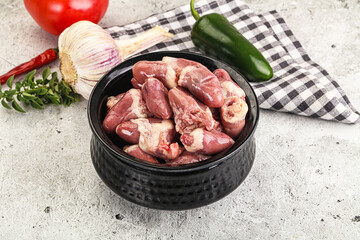 Fresh raw chicken hearts in the bowl