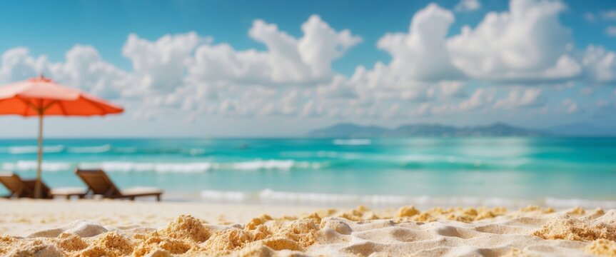 Abstract blur defocused background Tropical summer beach with golden sand, turquoise ocean and blue sky with white clouds on bright sunny day Colorful landscape for summer holidays.