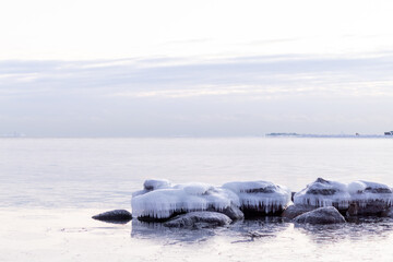 helsinki seaside promenade on a cold icy winter day in helsinki finland with sunset in the...