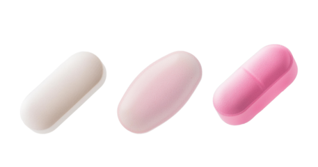 Close-up of three different colored pills isolated on a white background, representing medication, health care, and pharmaceuticals.