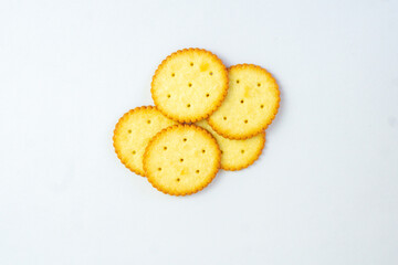 A stack of delicious wheat round yellow biscuits with isolated background