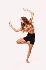 Fototapeta premium Yoga balance pose: ethnic-inspired asana fusing tradition with modern practice